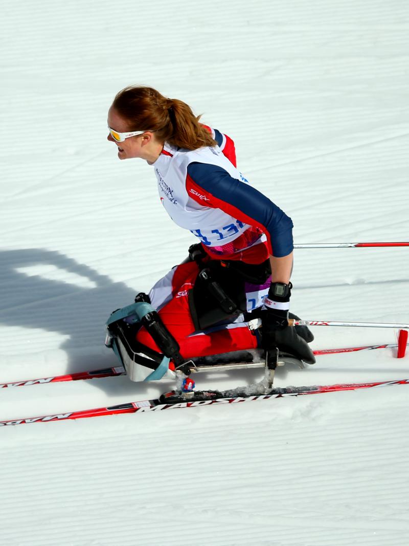 a female Para Nordic skier on the snow