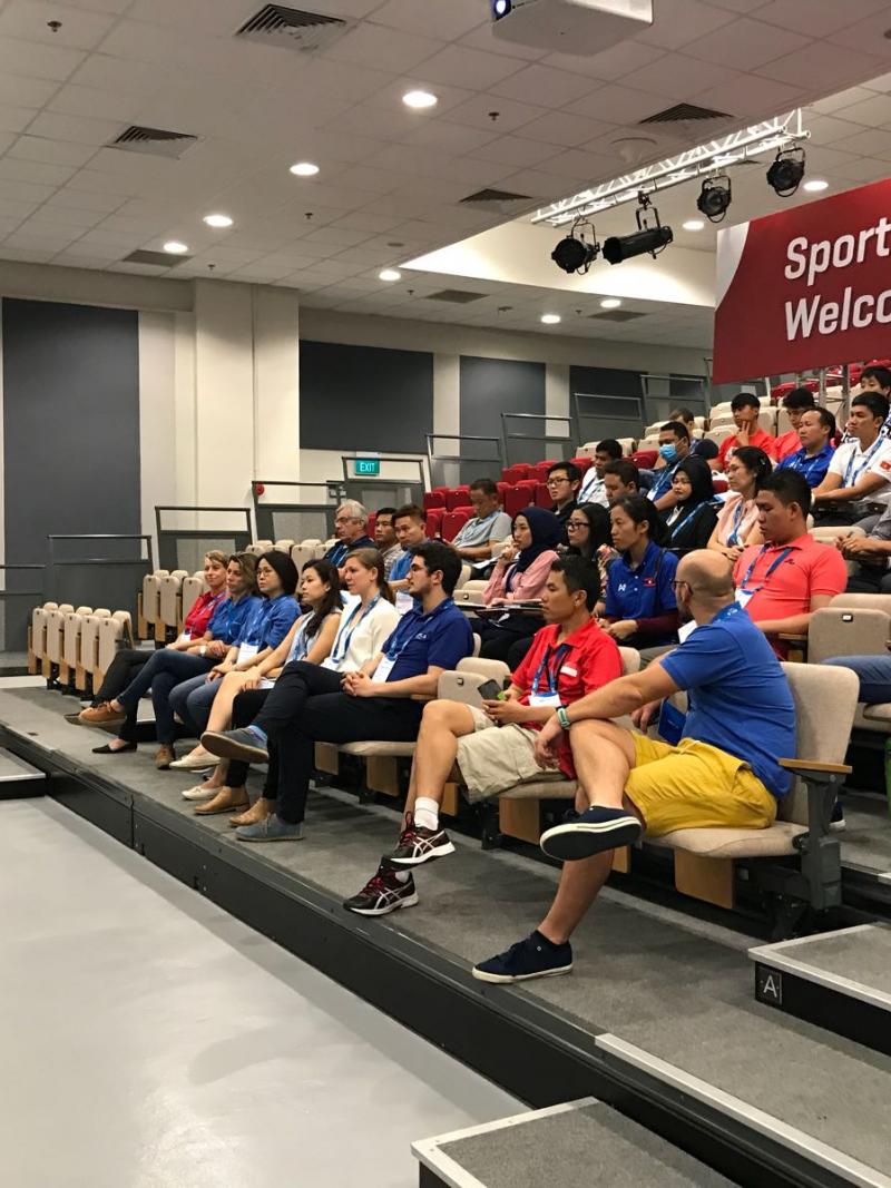 Educator delivers course to audience of coaches and classifiers