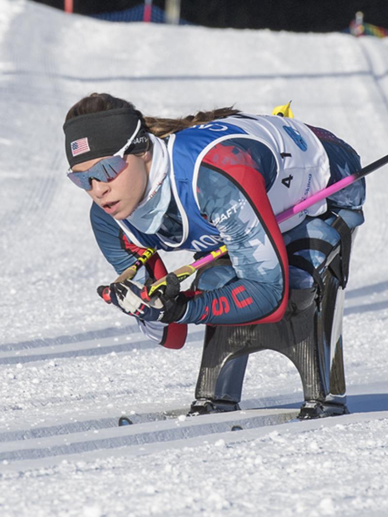 Oksana Masters skiing on a sit-ski