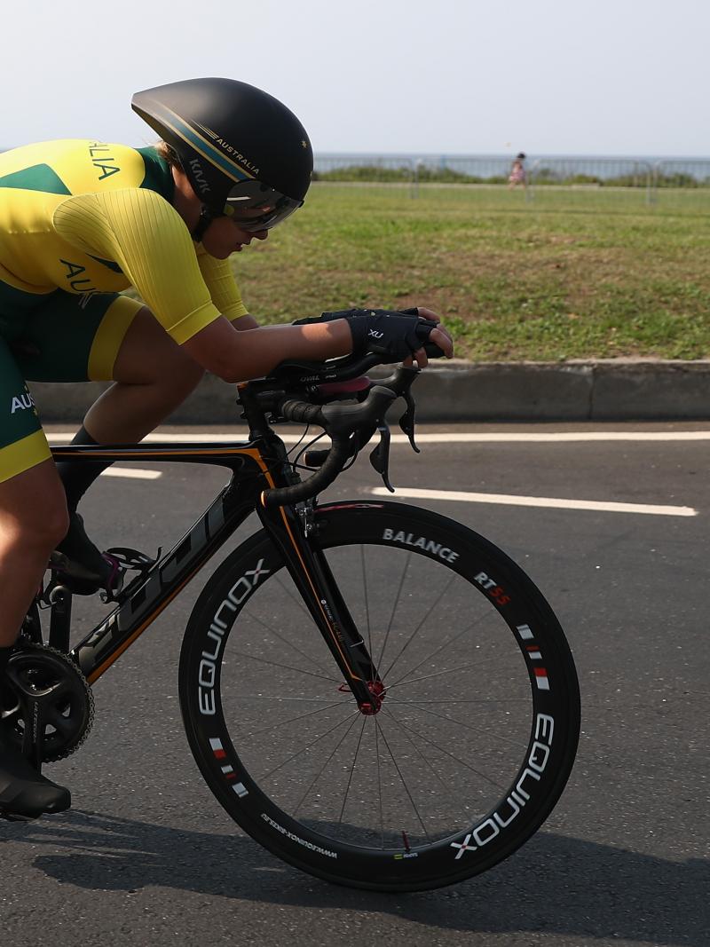 a female Para cyclist on the road