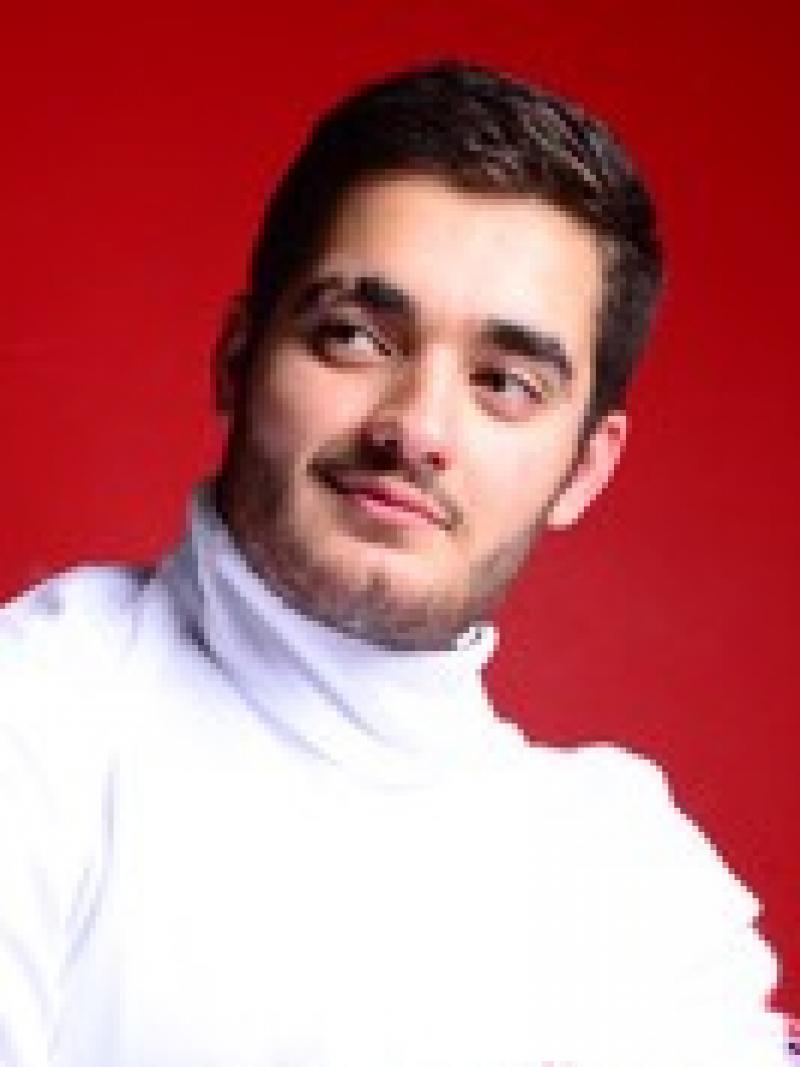 Portrait of wheelchair fencer with helmet off