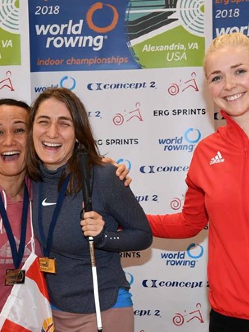 a group of female rowers celebrate
