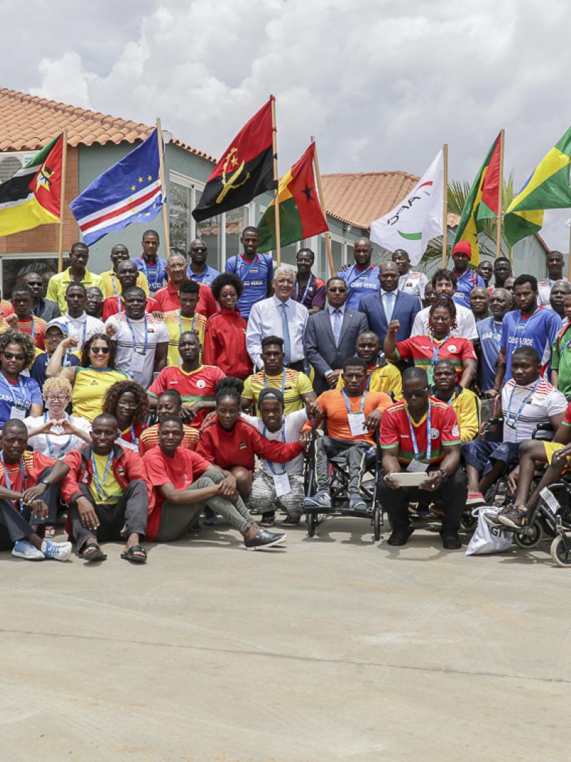 Around 50 participants of Agitos Foundation training camp pose for a group picture in Luanda, Angola