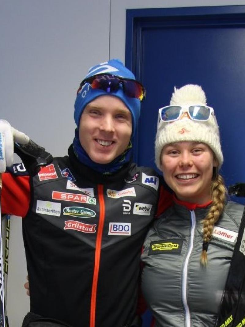a male and female Para Nordic skier smiling together