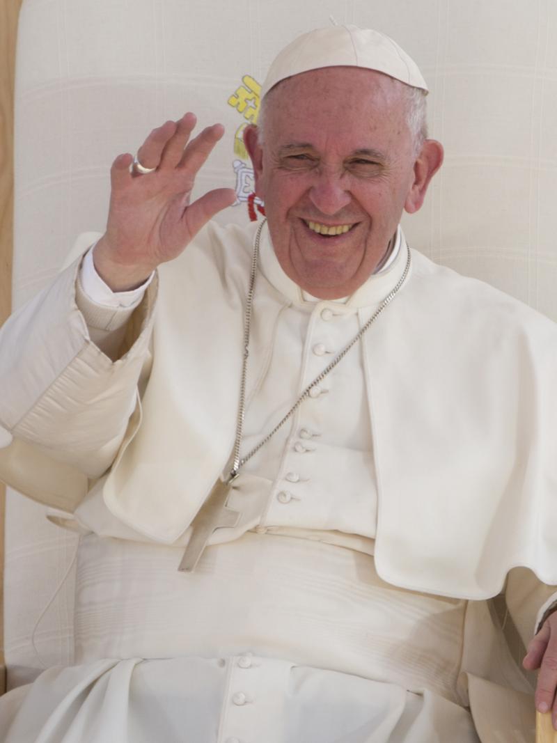 The Pope laughing his chair