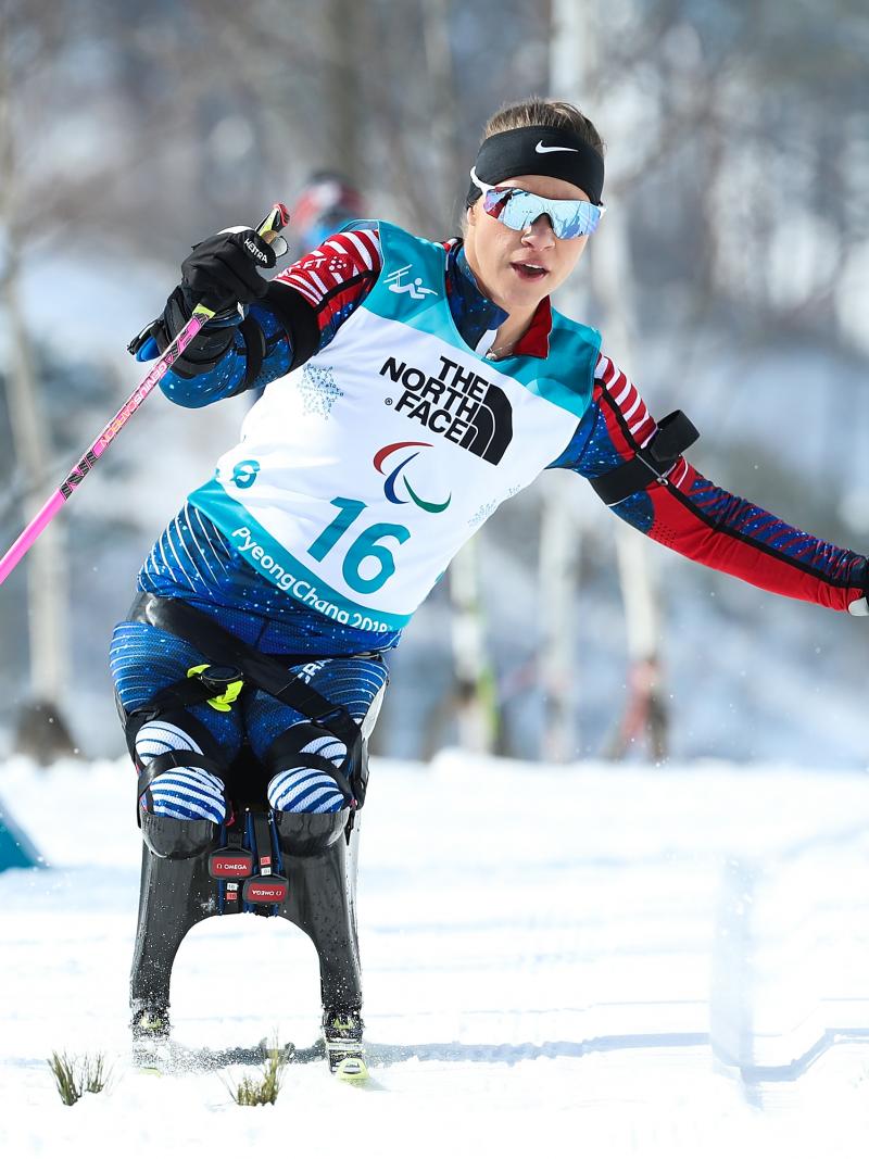 a female sit skier in action