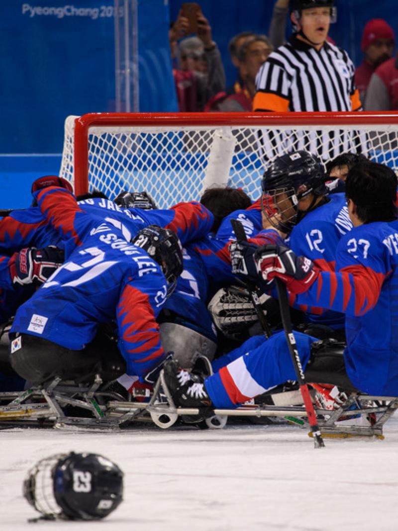 Para ice hockey players celebrating