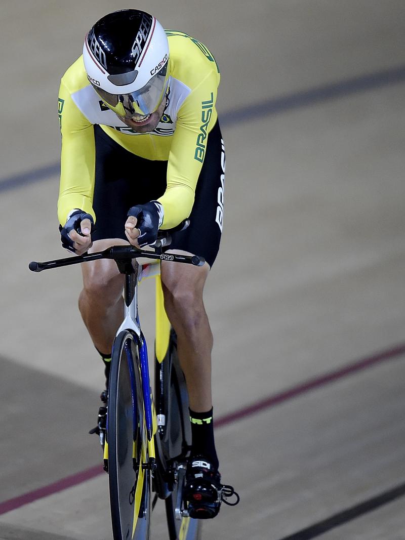 A male Para cyclist going round the track