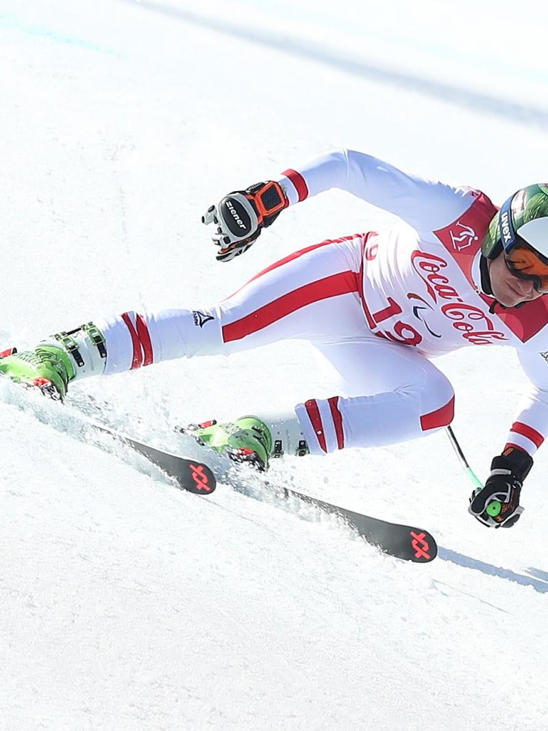 a male Para alpine skier in action