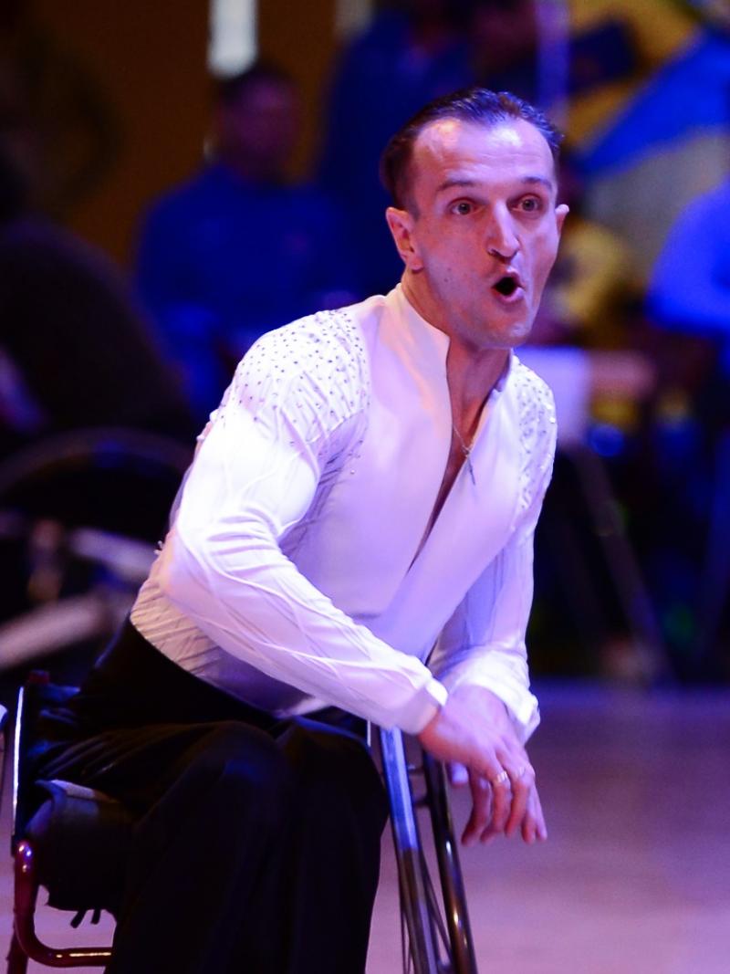 a male wheelchair dancer mid-move