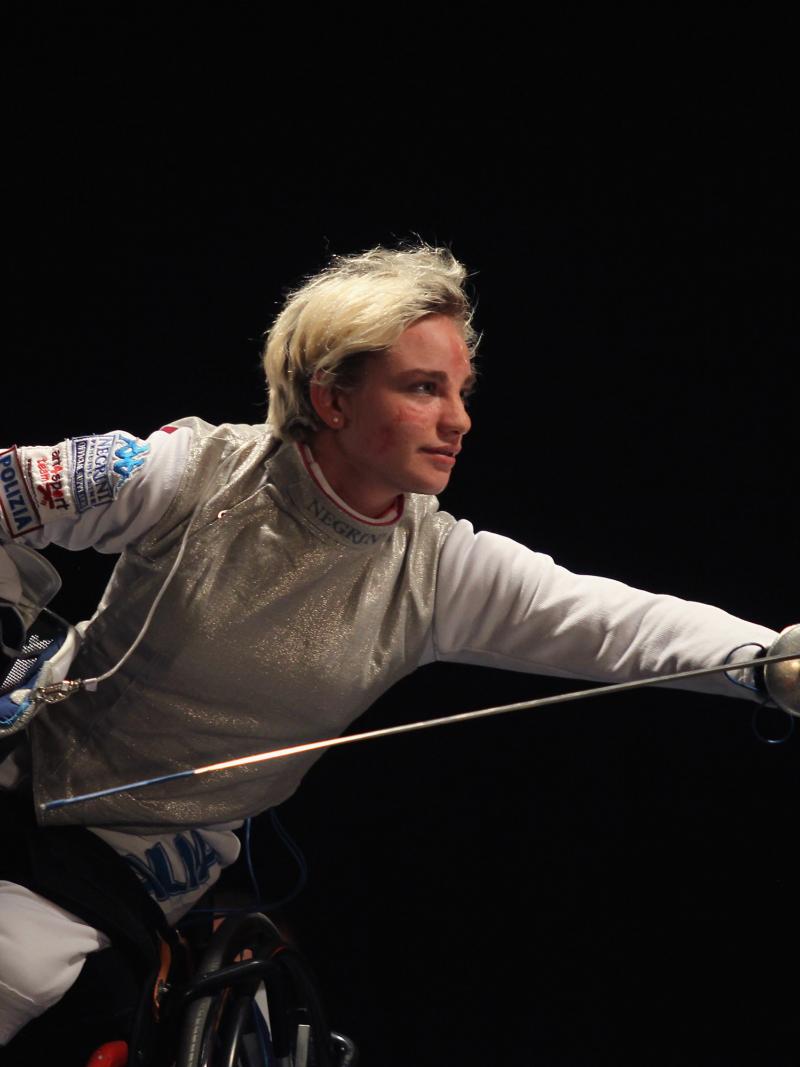a female wheelchair fencer in action