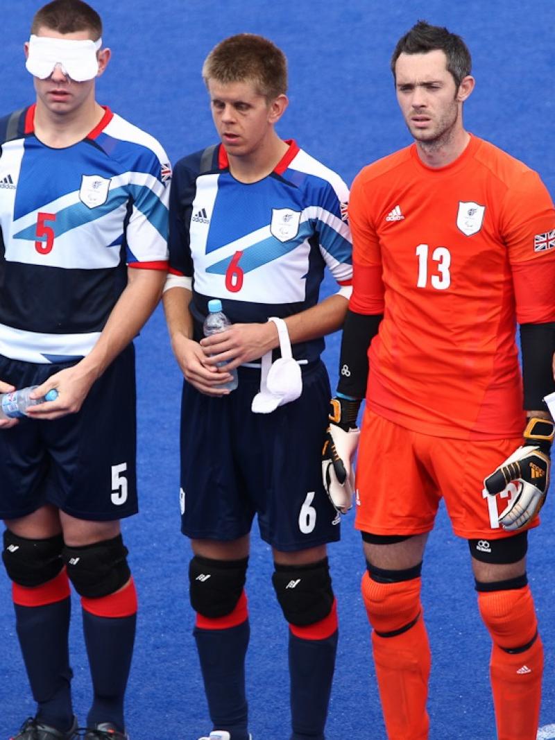 a group of blind football players line up before a match