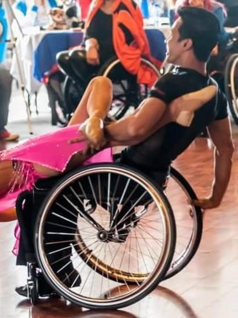 a Para dance couple in a pose on the dance floor