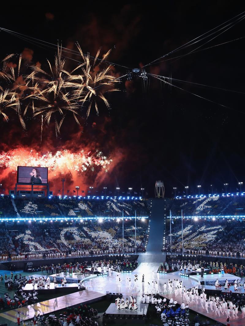 a stadium with fireworks exploding above it