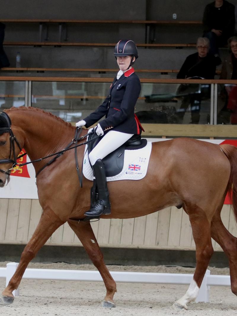 a female Para equestrian rider on her horse