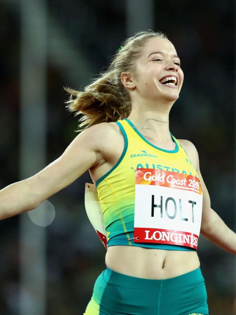 a female Para sprinter crosses the finish line