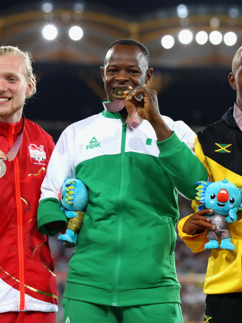 Suwaibidu Galadima celebrating on the podium together with James Arnott and Tevaughn Thomas at Gold Coast 2018.