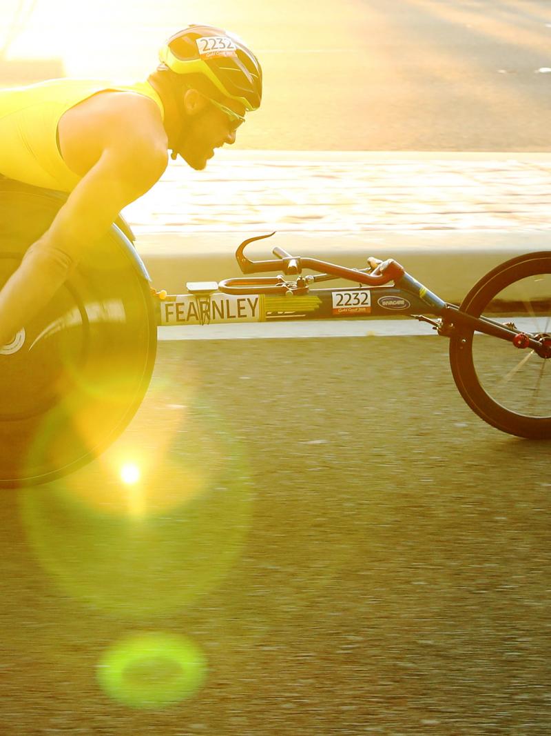 Athlete on wheelchair taking part in race