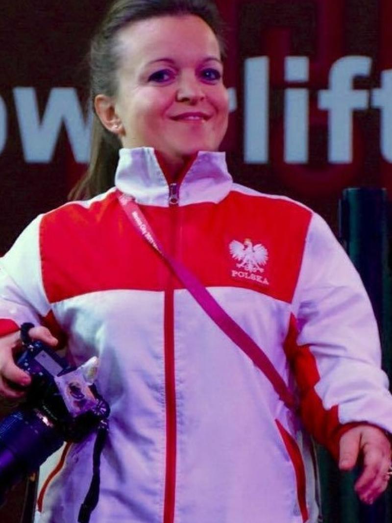 a female powerlifter with a camera