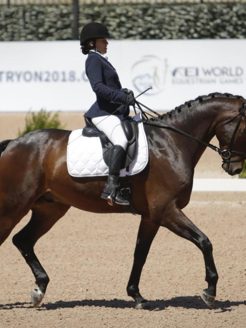 A female Para equestrian rider on her horse