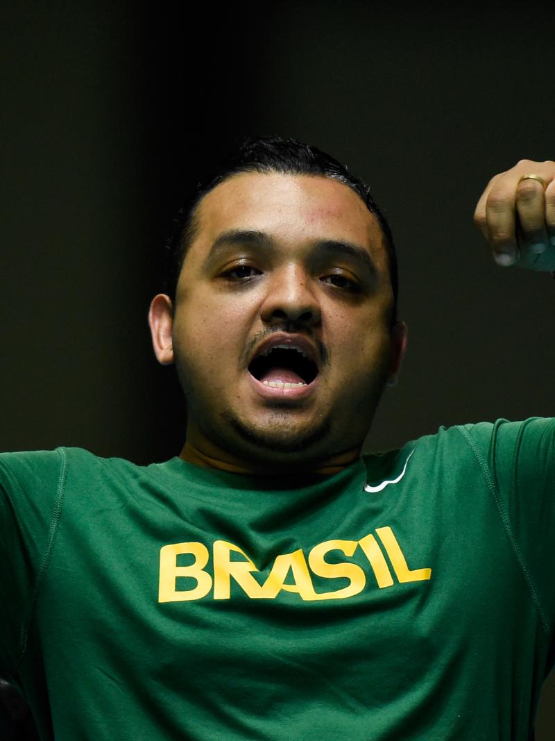 a male boccia player celebrates a throw