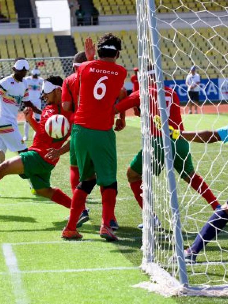 a blind footballer takes a shot