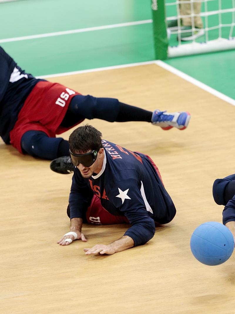 three goalball players in action