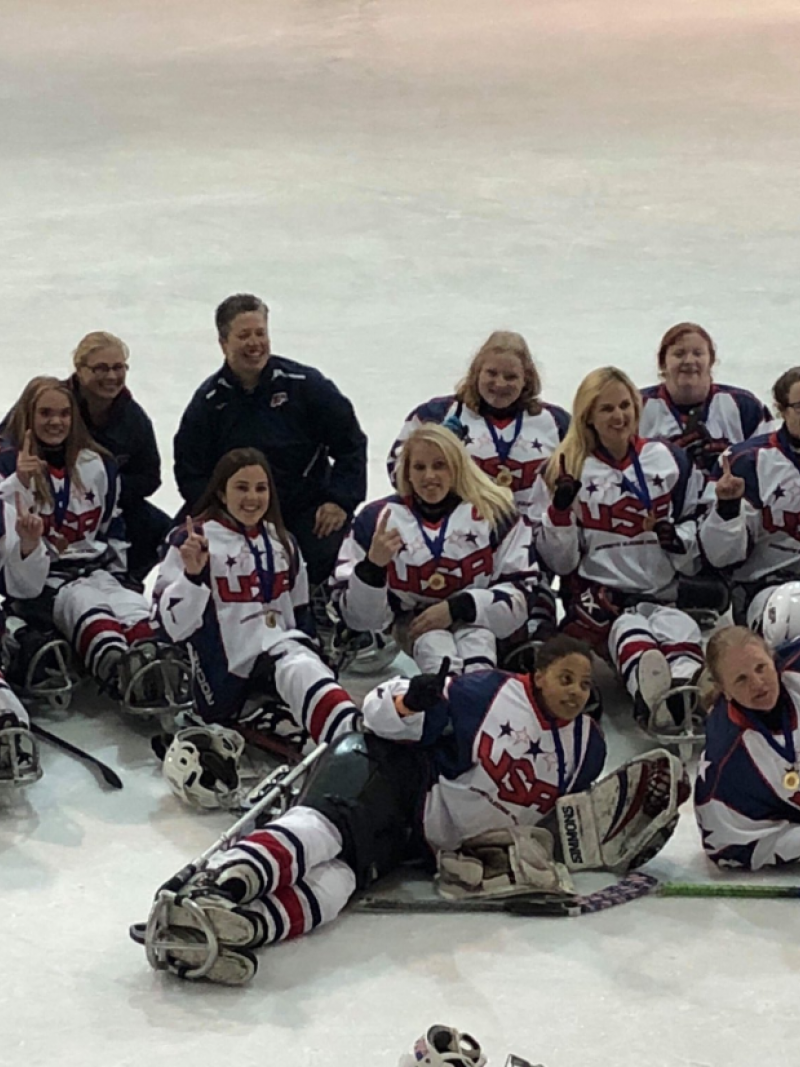 A group of women on sledges on ice