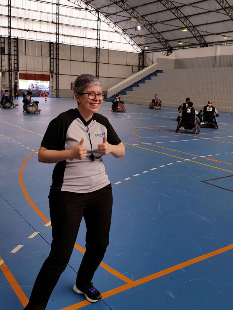 Female referee poses