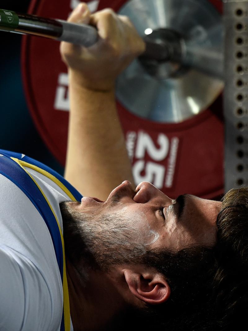 A male powerlifter prepares to lift