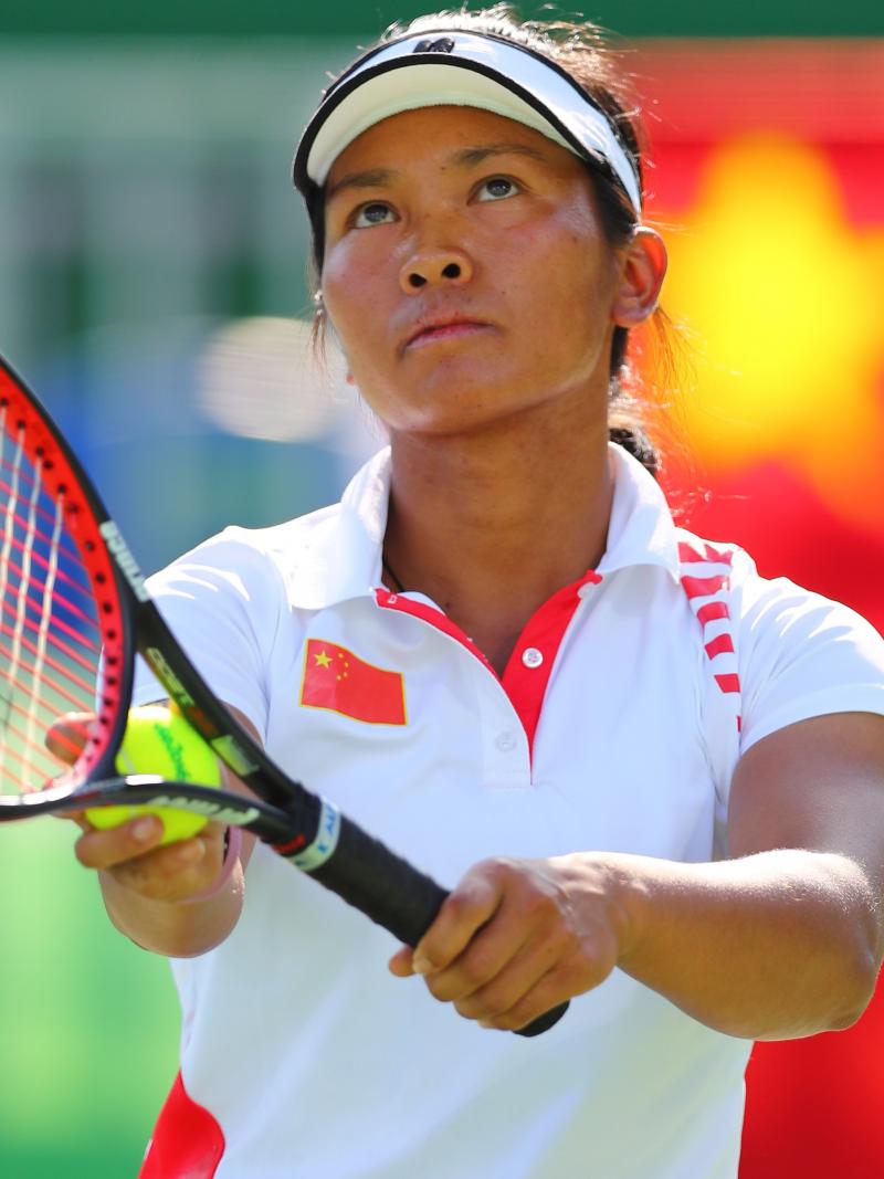 China's Zhenzhen Zhu lines up a serve.