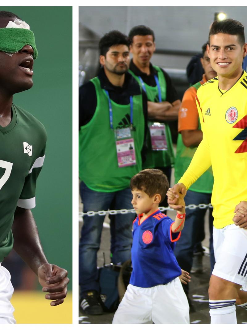 a male blind footballer and a male able-bodied footballer on the pitch