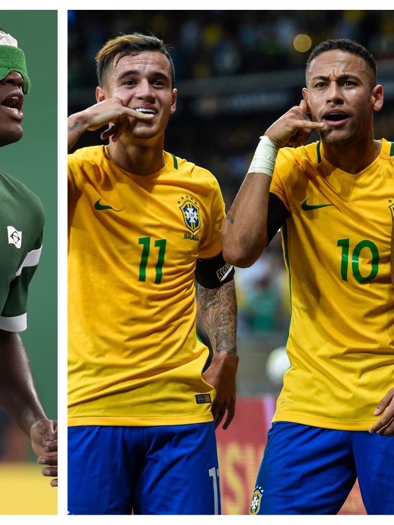 a male blind footballer and three male able-bodied footballers celebrating a goal