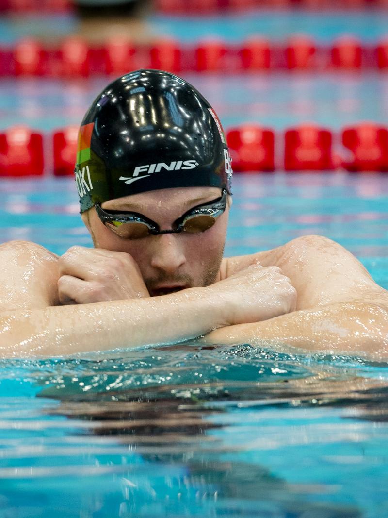 Male swimmer in goggles in the pool