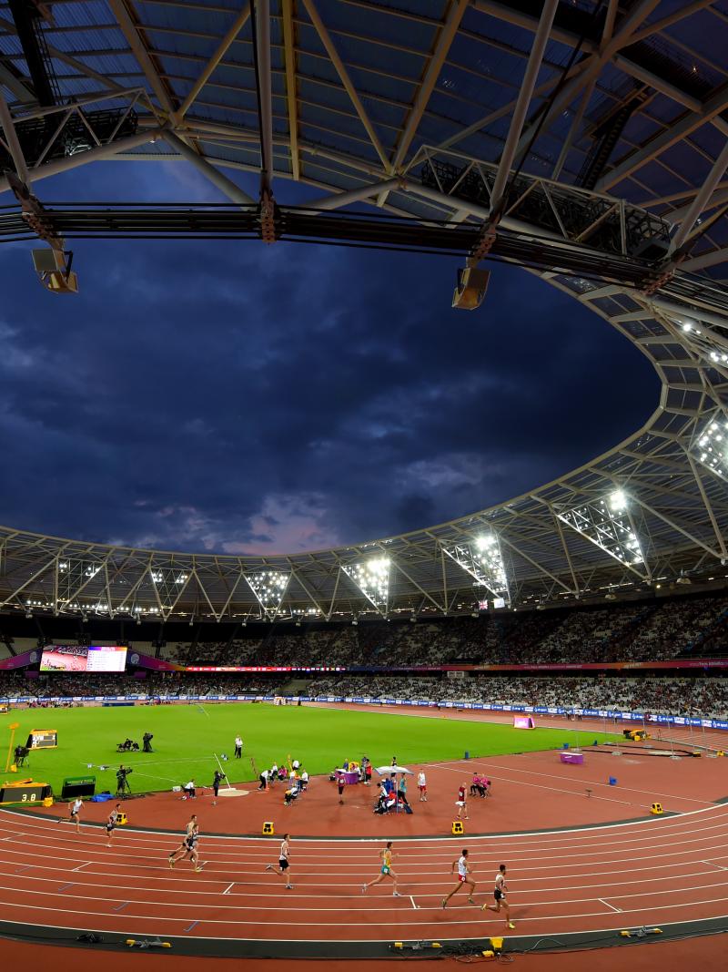 a wide shot of an athletics stadium at night