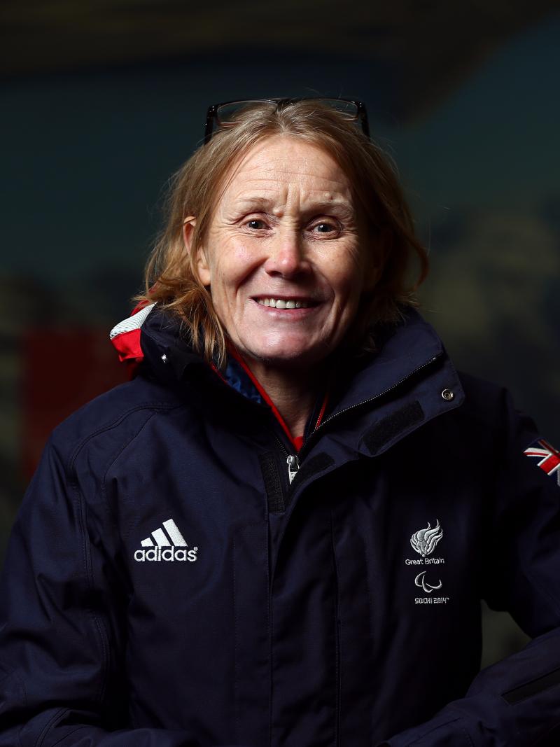 a woman smiles at the camera