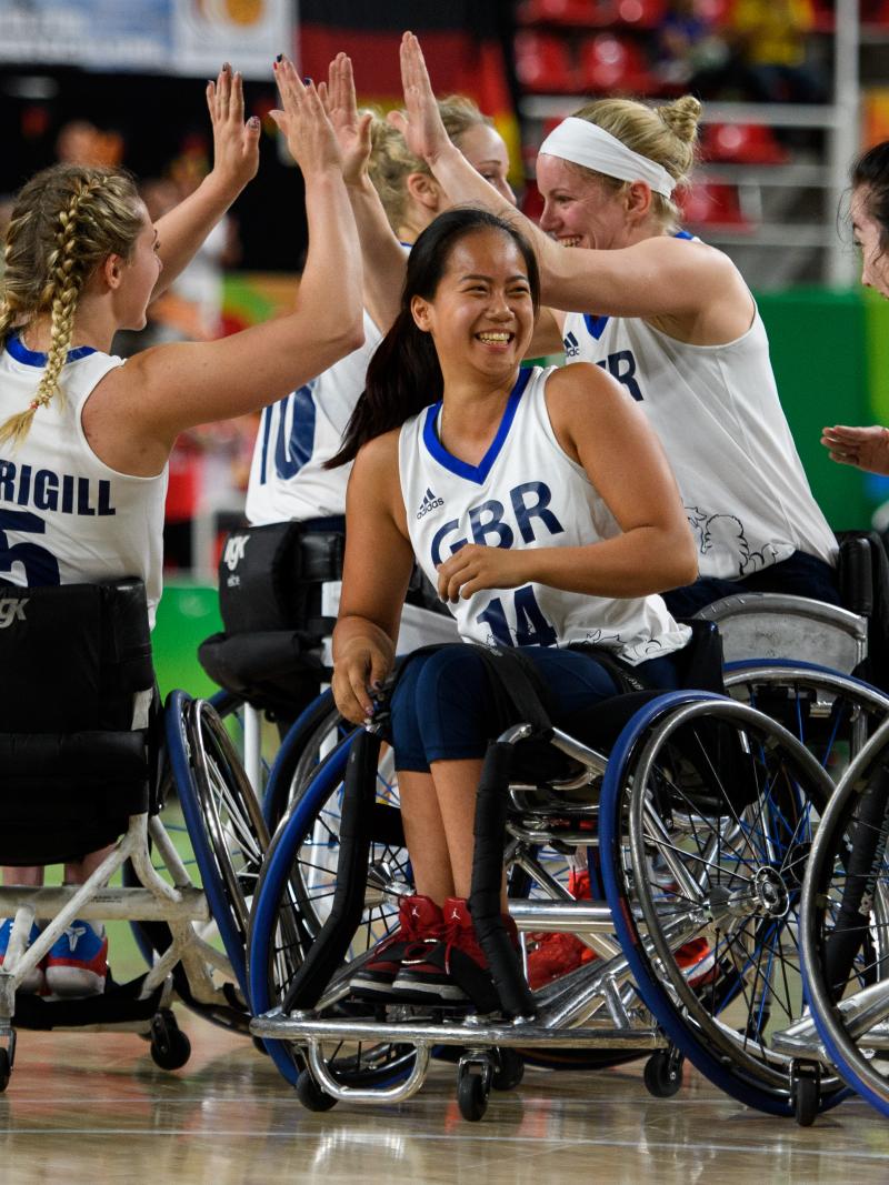 Women wheelchair basketball players celebrate