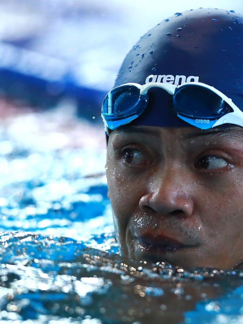 a male Para swimmer in the water