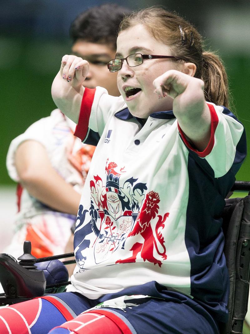 a female boccia player celebrates