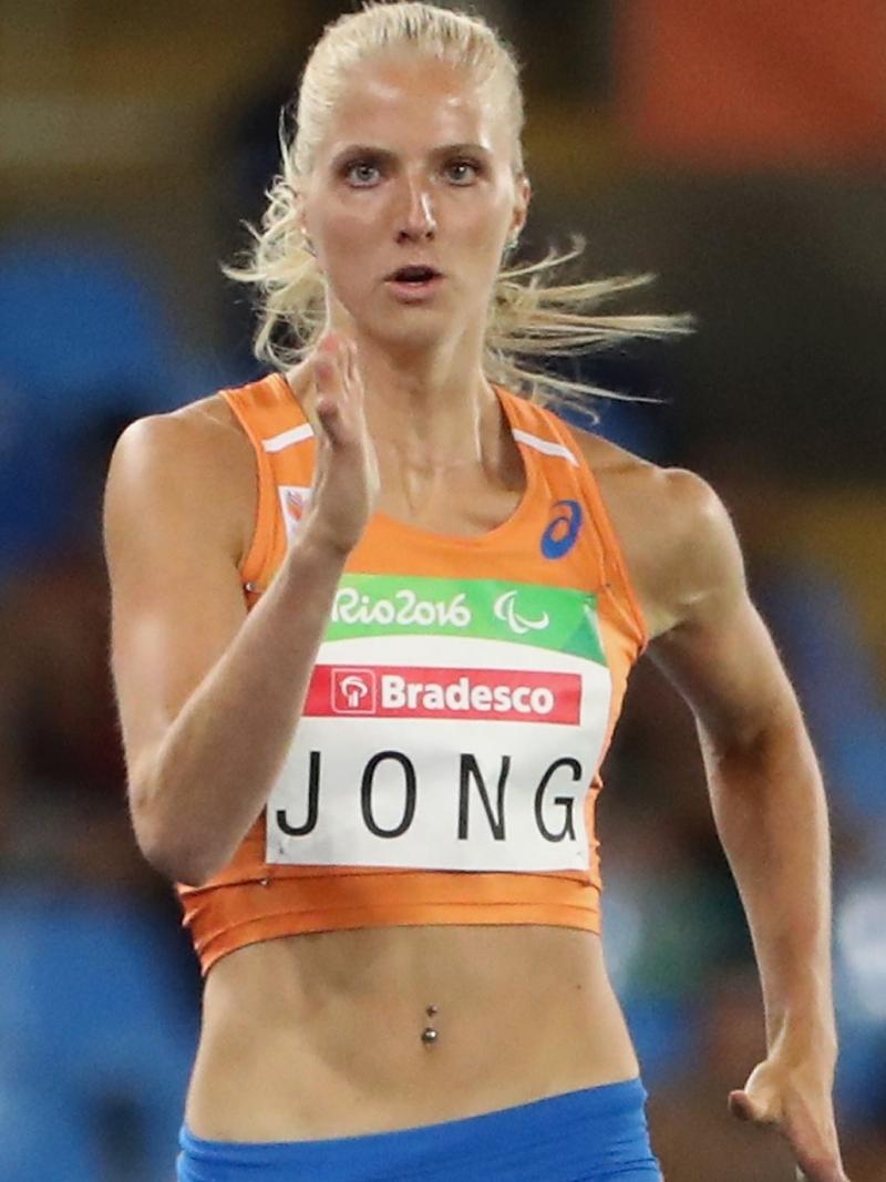 a female double amputee sprinter running in her lane
