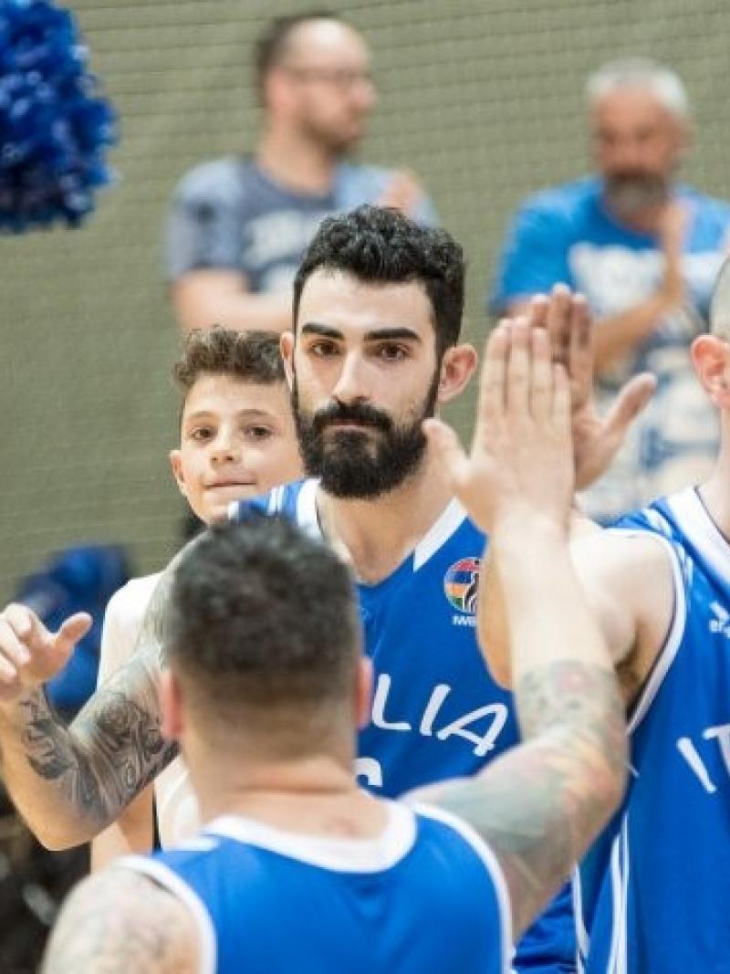 a group of male wheelchair basketballers on court