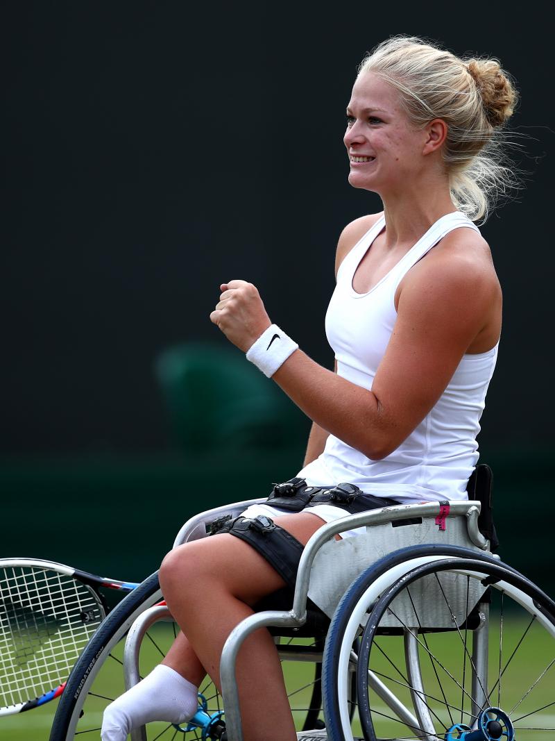 female wheelchair tennis player Diede de Groot plays a shot on grass