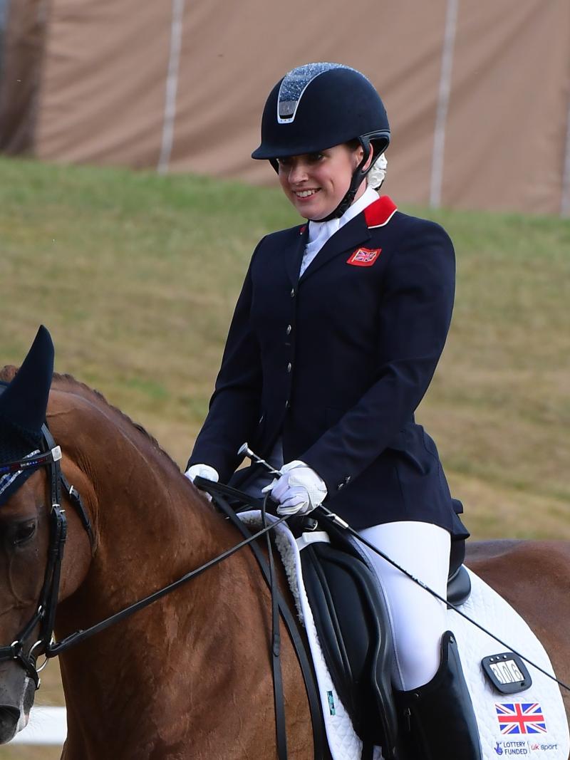 female Para equestrian rider Natasha Baker smiles on her horse