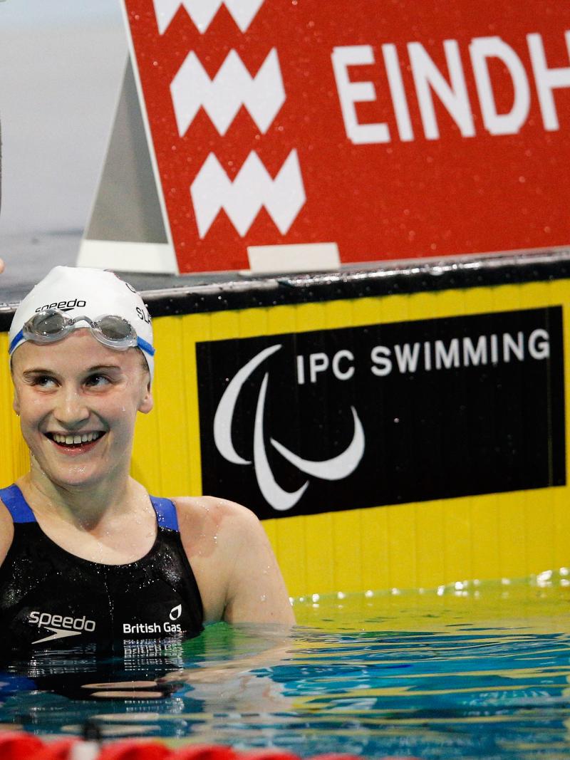Woman in a swimming pool smiling