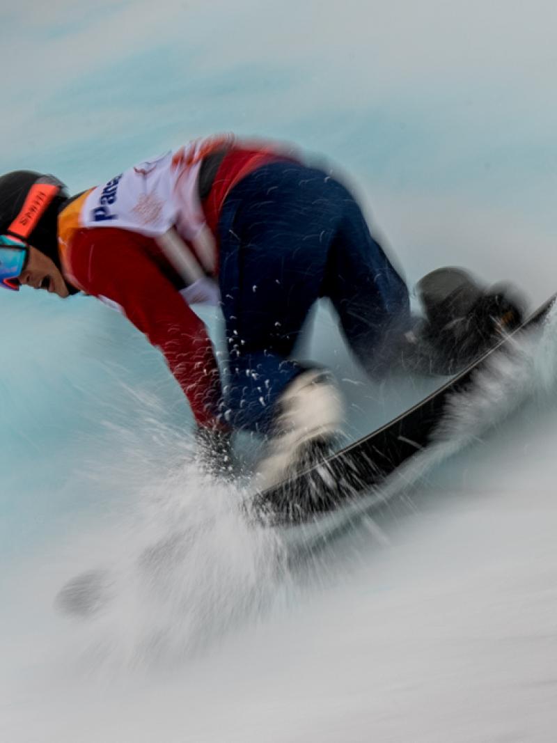 Men on a snowboard in the snow