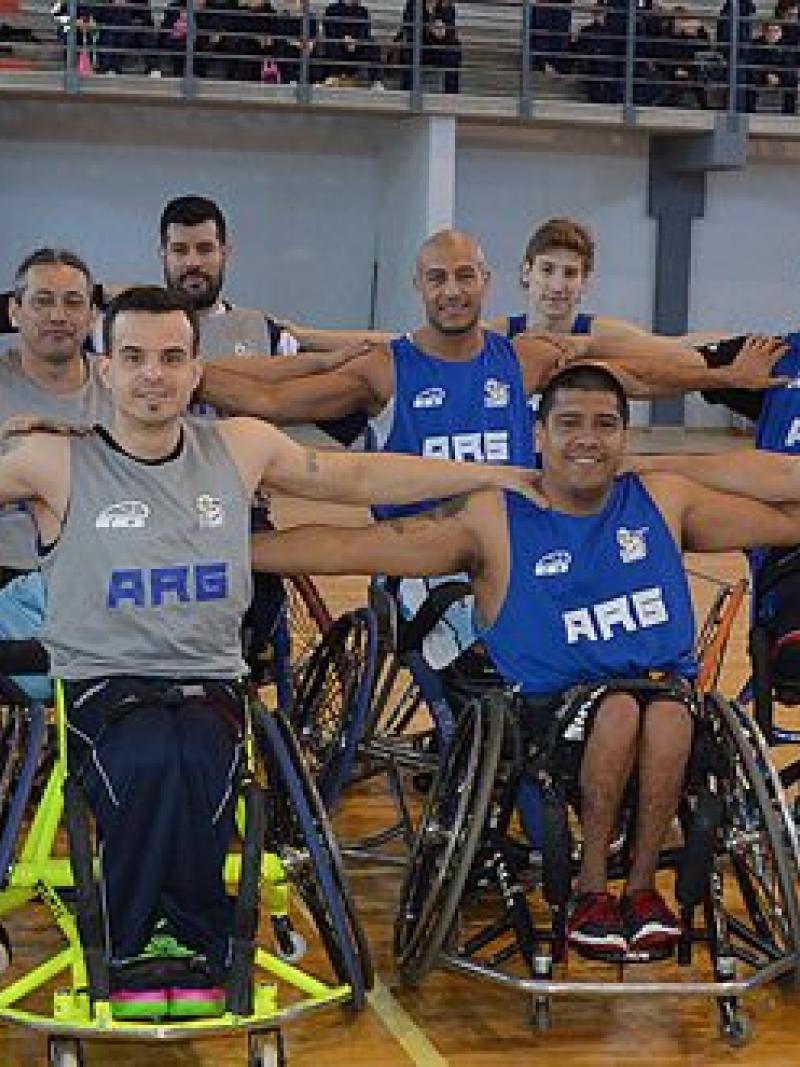 a group of Argentinian male wheelchair basketballers pose on a court