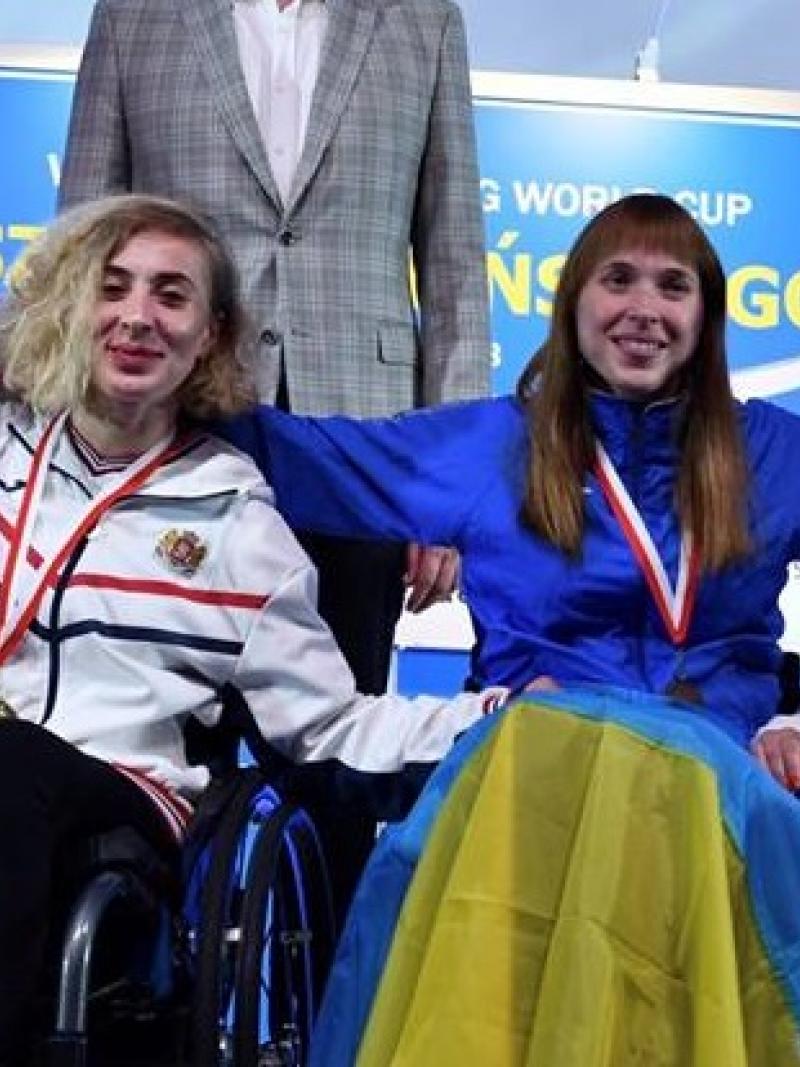 four female wheelchair fencers on the podium with Anastasia Kastsiuchkova on the right