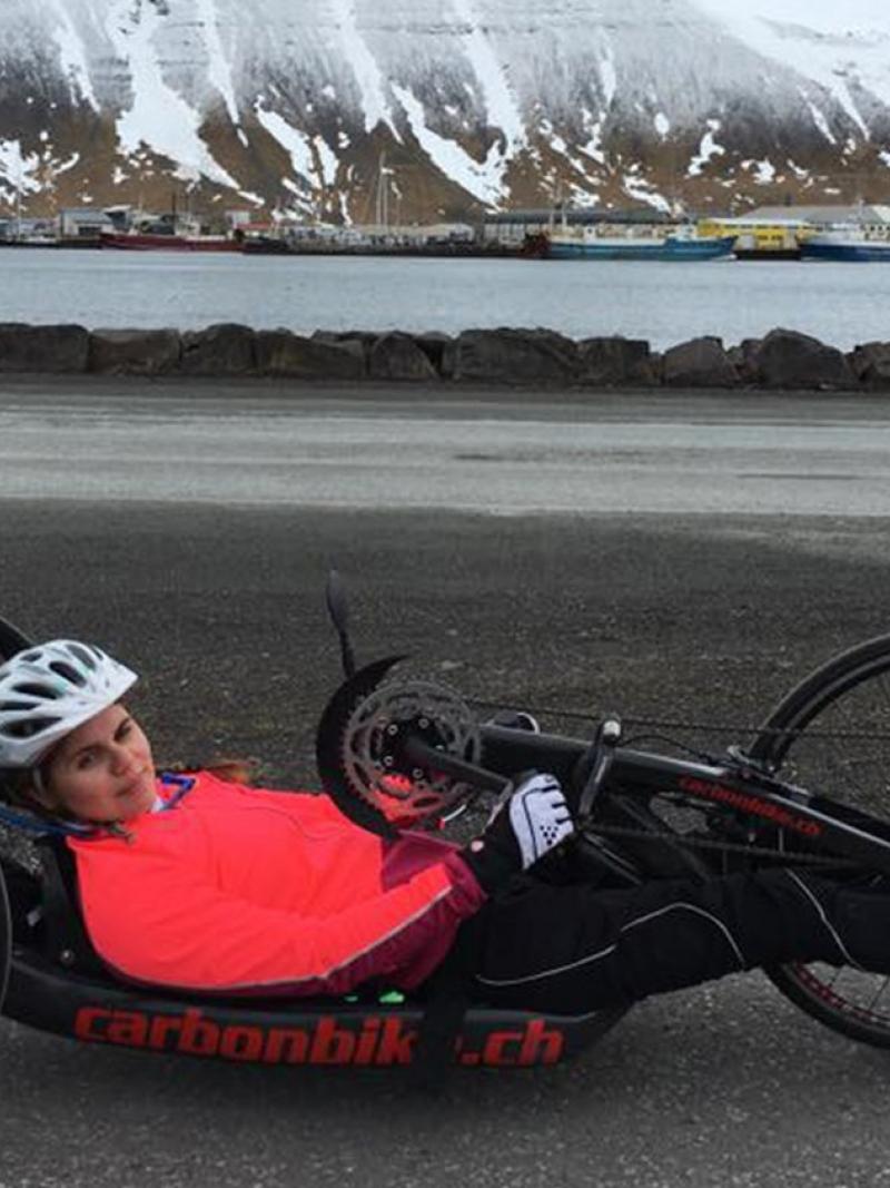 female Para cyclist Arna Albertsdottir in action on the road
