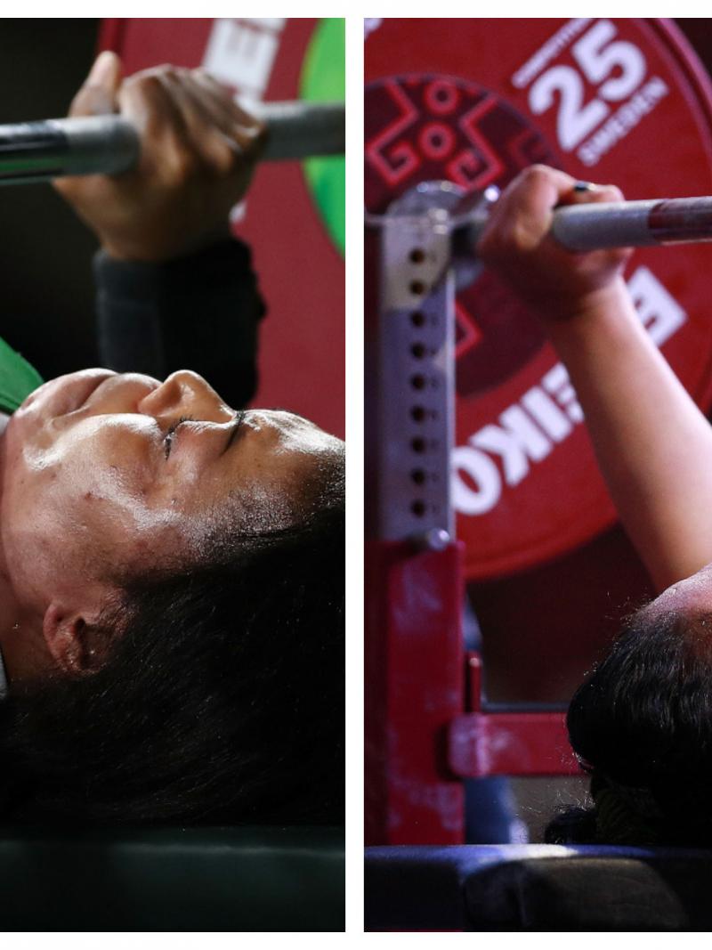 female powerlifters Lucy Ejike and Gihan Abdelaziz on the bench ready to lift