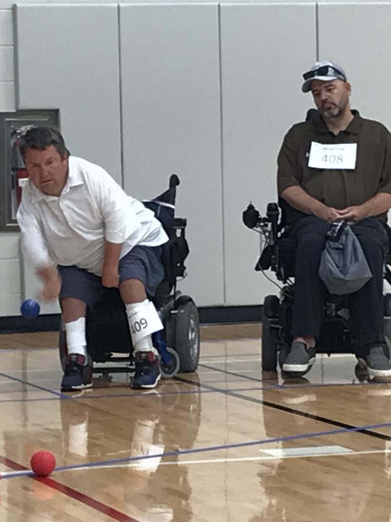 male boccia player Nick Taylor takes a throw
